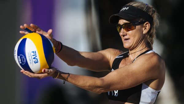 Kerri Walsh Jennings reading to serve the ball to a win.