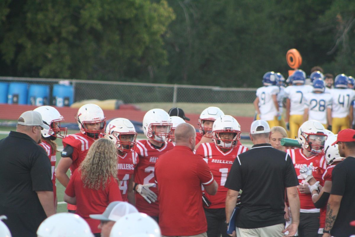 Yukon plays against Piedmont September 5th, 2024. Coach Tschetter takes in the team to give them a mental push into the next play. 